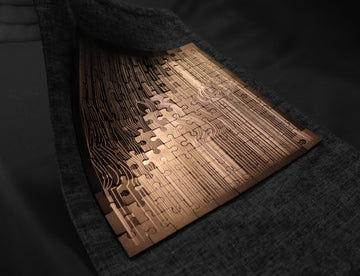 Shiny metal puzzle pieces shimmering in reflected light, highlighting the polished aluminum finish.